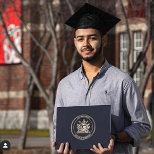 A student wearing his graduation cap