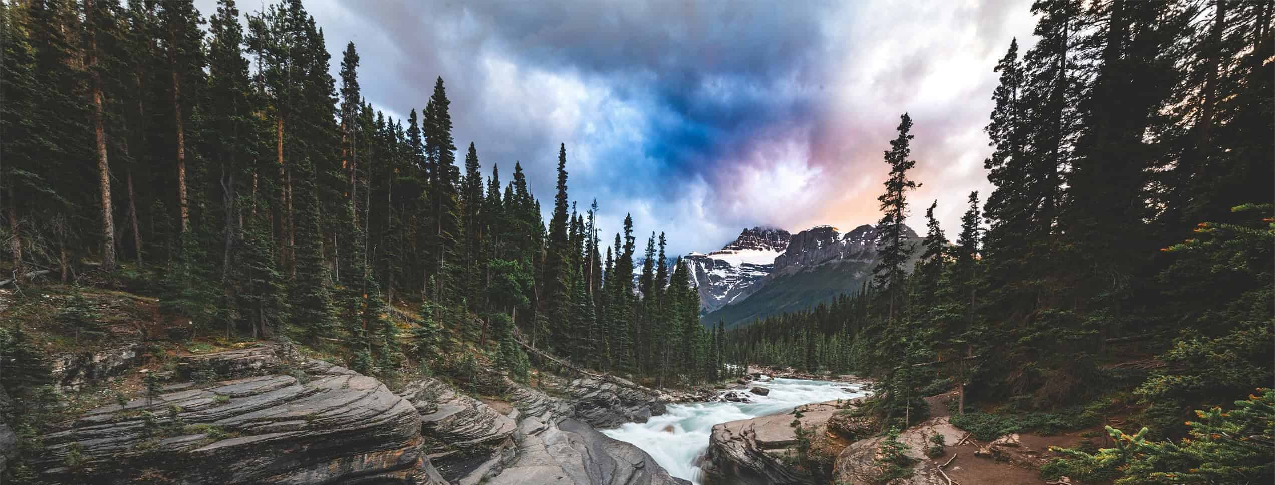 a view of the moutains and stream in between