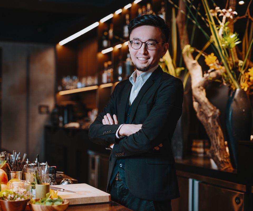 Person in formal attire standing confidently