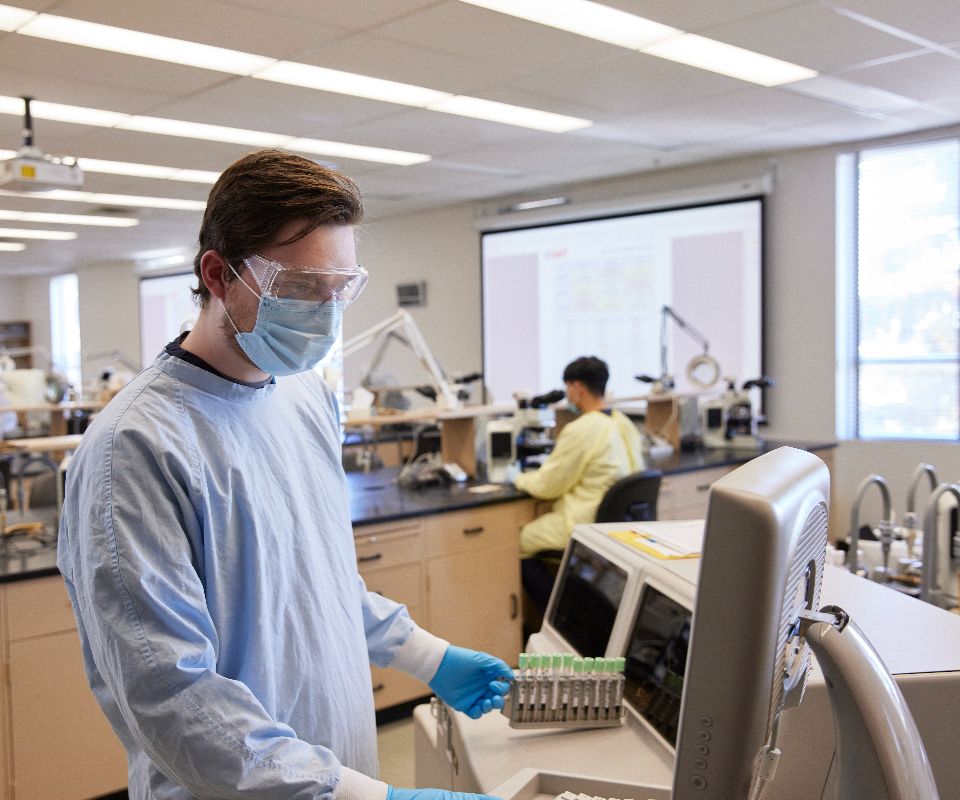 medical student analyzing lab samples in testing room