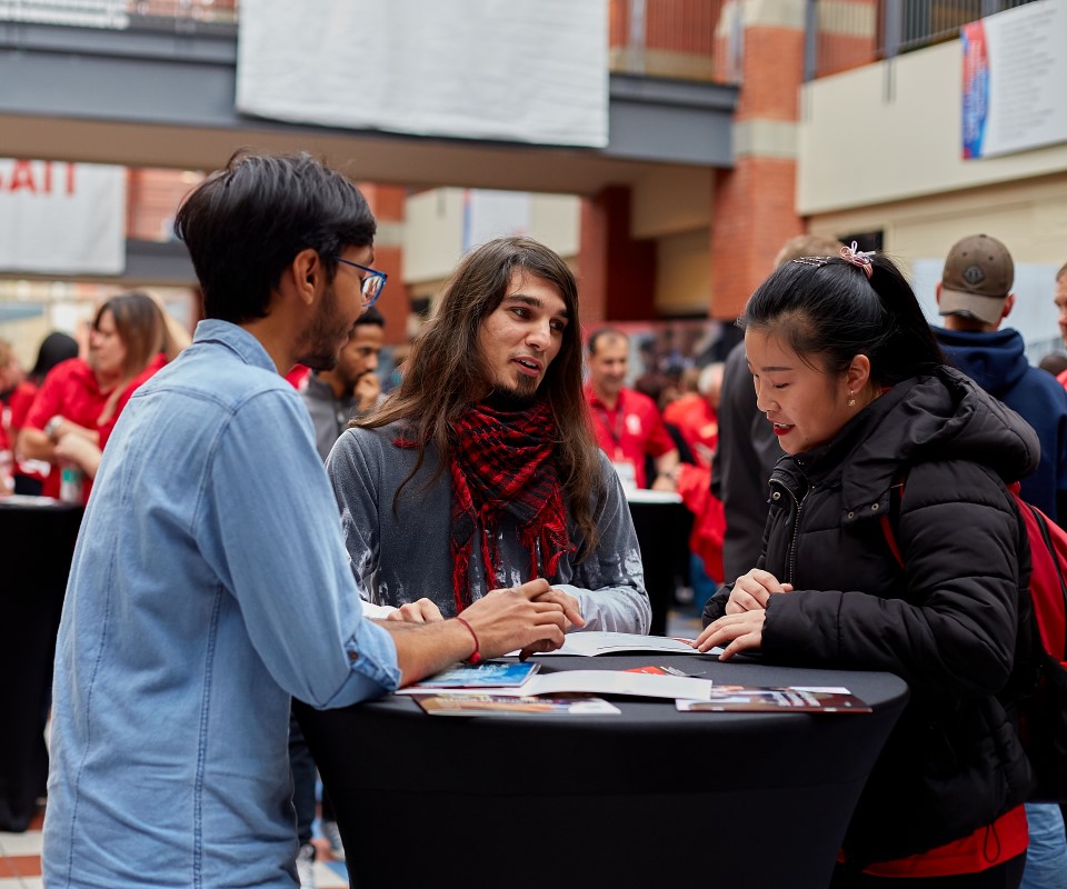 students talking at open house