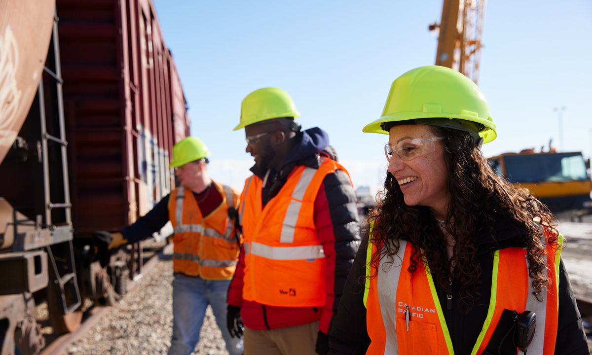 workers near a train on railway track