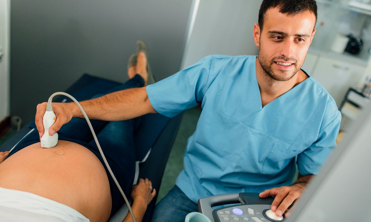 healthcare worker performing ultrasound on patient