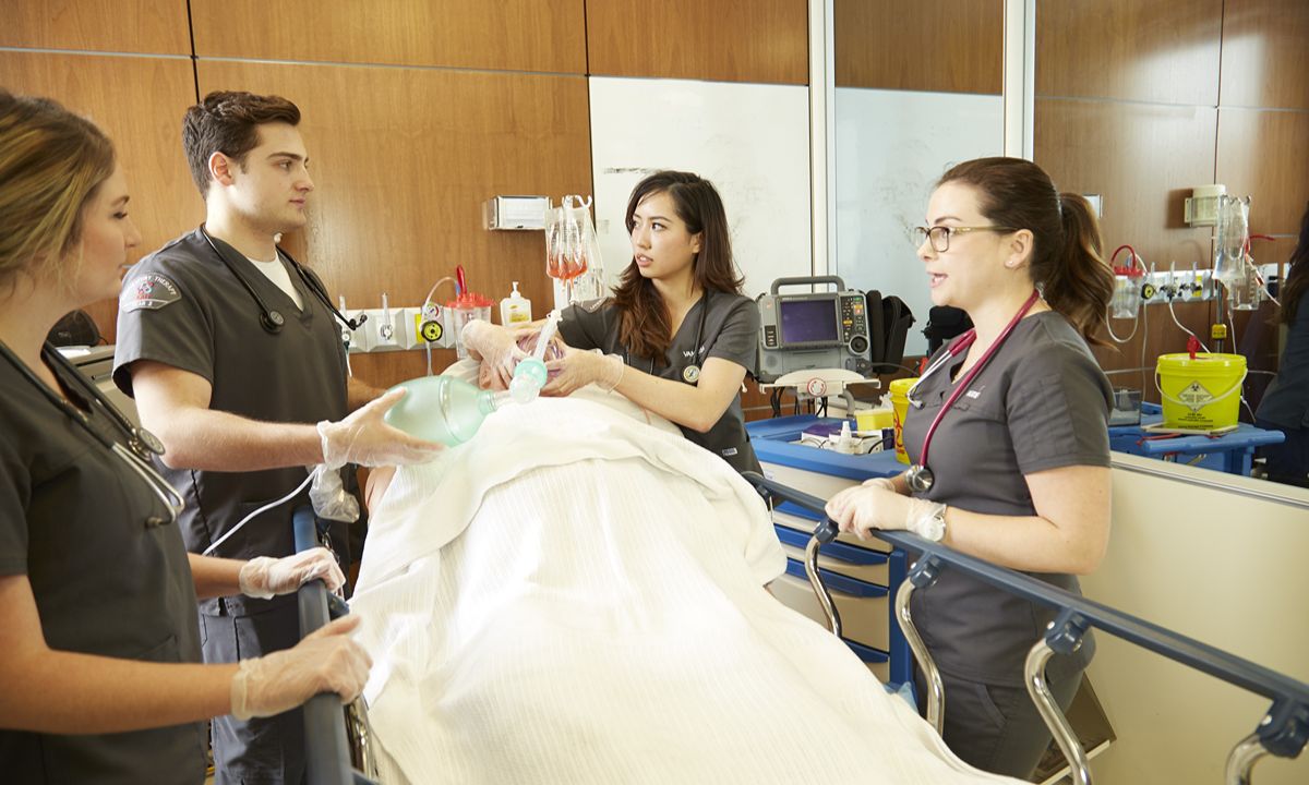 medical team performing procedure in emergency room