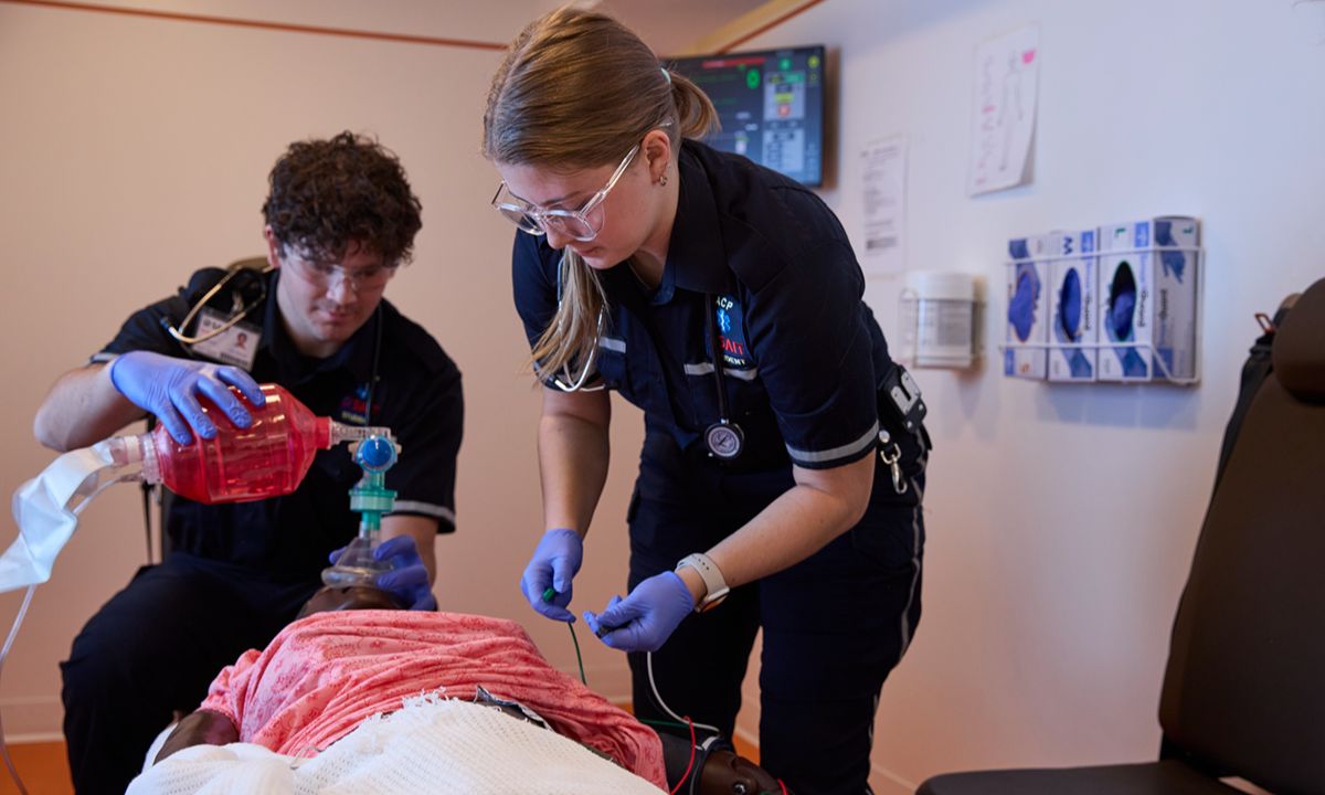 medical team resuscitating patient in hospital room