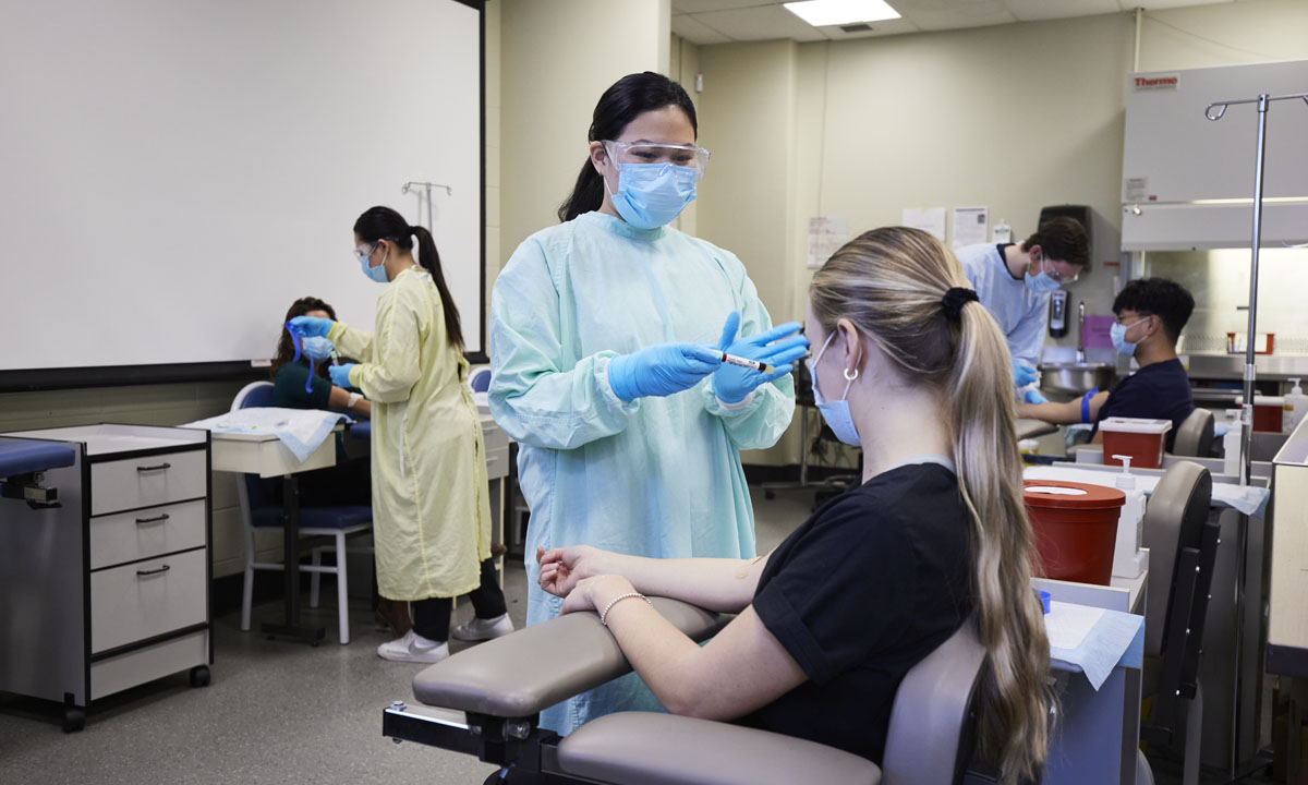 healthcare workers practicing procedures in a clinical setting
