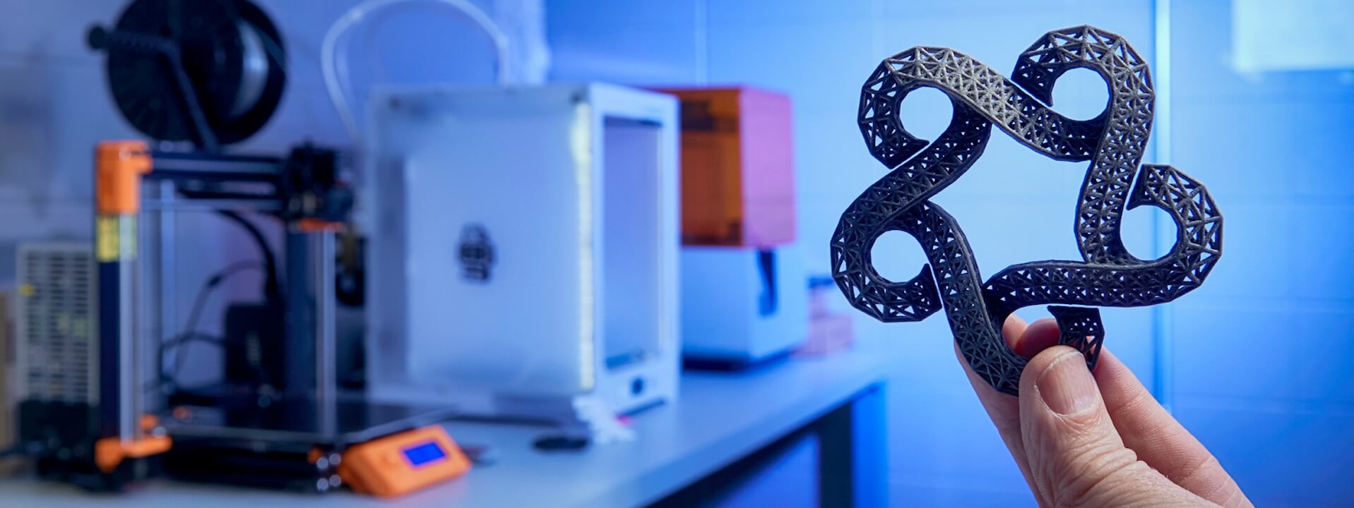 A person holding a 3D print of the catalyst