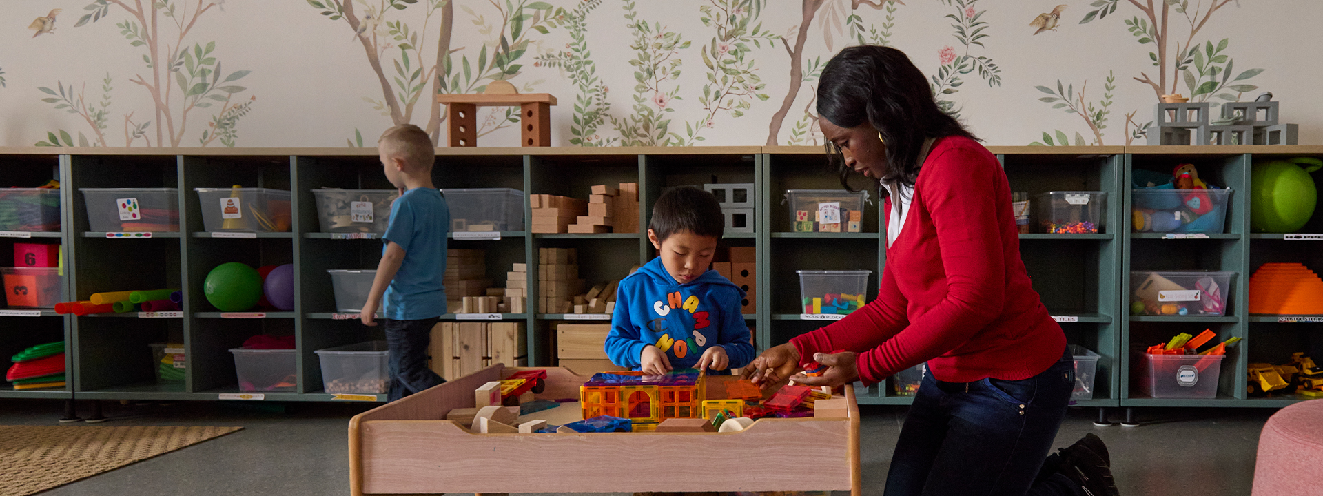 A instructor with young students in a classroom