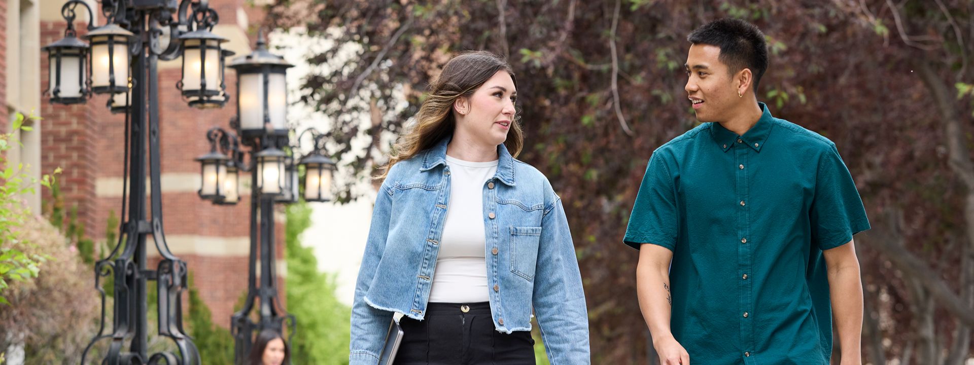 two people walking near heritage hall campus scene