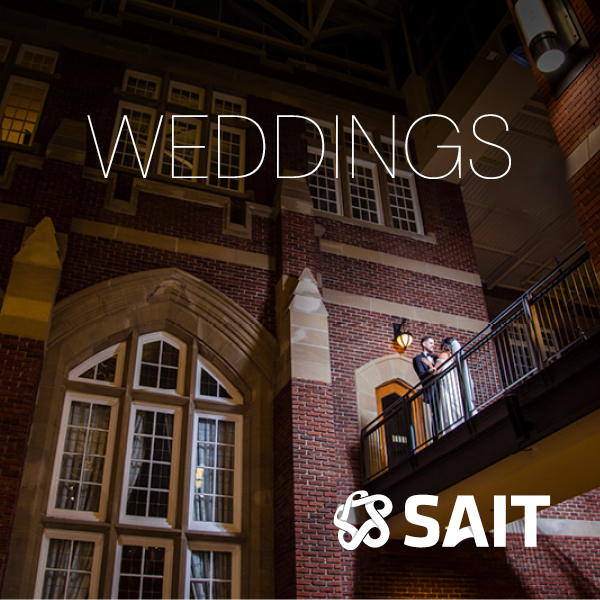 An indoor architecture shot of SAIT featuring a white SAIT logo in the bottom corner.