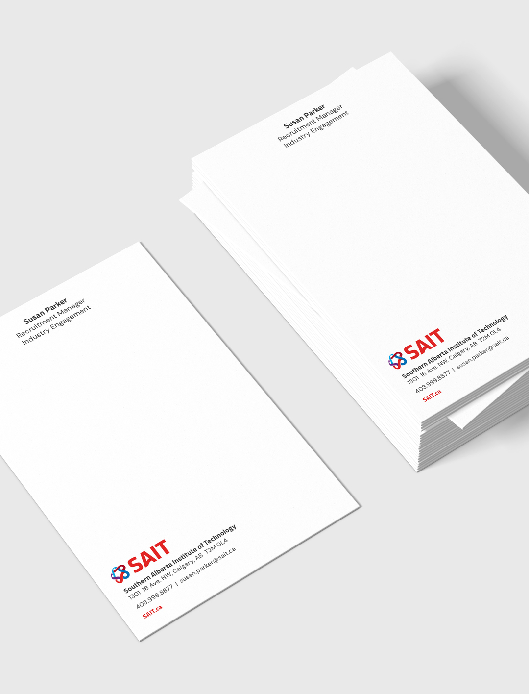 SAIT branded letterheads and envelopes.