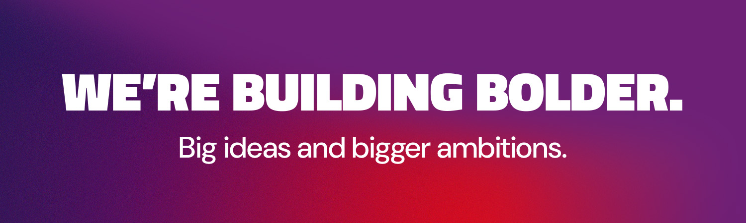 Red to purple gradient banner with the words "We're Building Bolder. Big ideas and bigger ambitions."