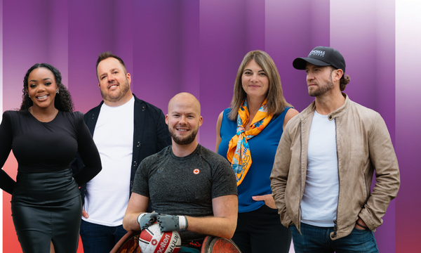 Group of men and women in front of a gradient background.