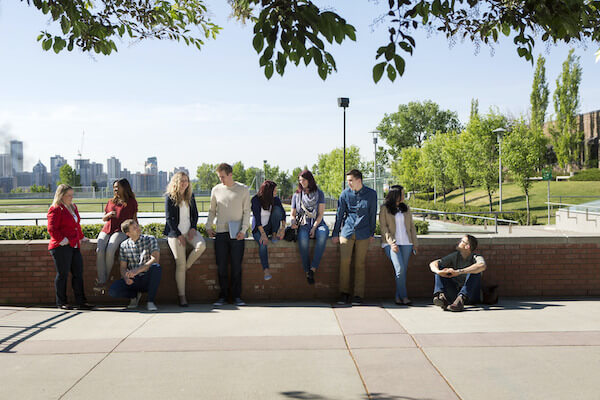 A group of students outside SAIT's parking garage