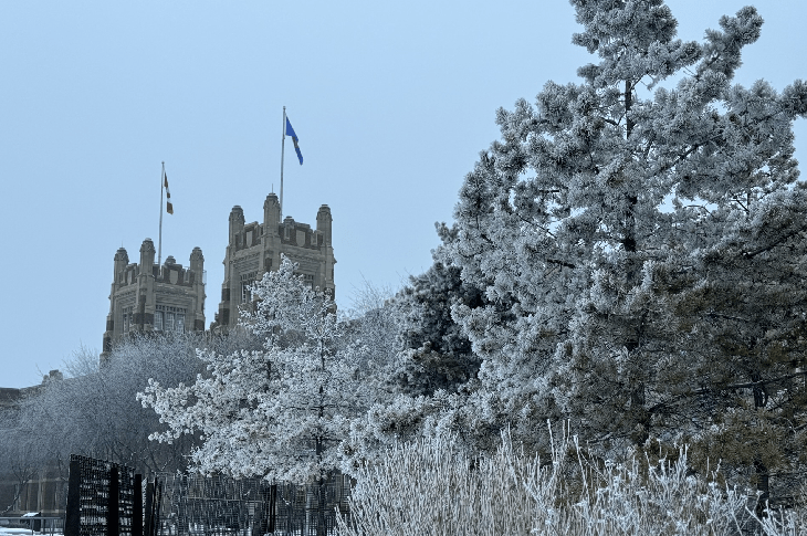 A winter scene featuring a 3/4 view of Heritage Hall on the SAIT Main Campus.