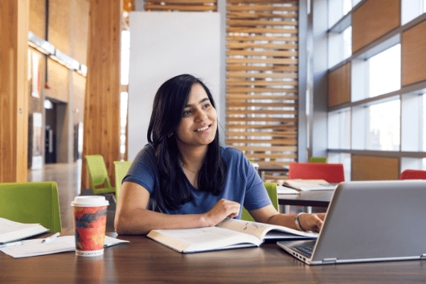 Woman smiling with laptop