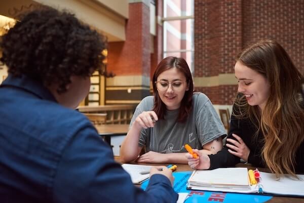Students studying around a table