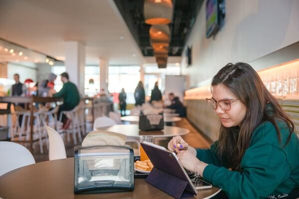 Student working on a computer in the Dining Centre