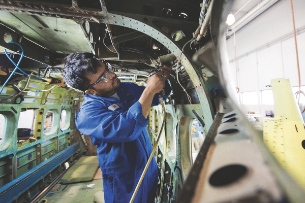 aircraft maintenance technician fixing plane