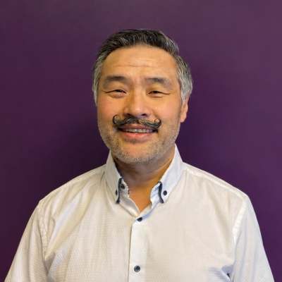 man in front of purple background