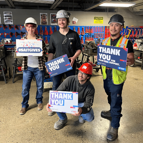 construction students holding thank you signs