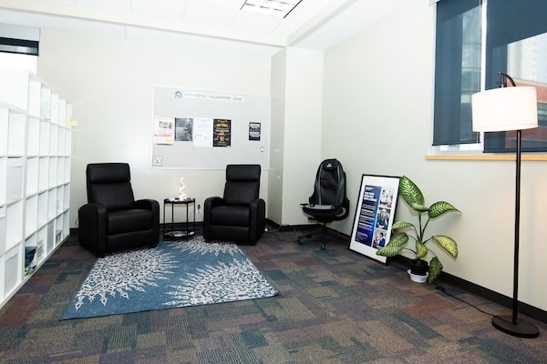 A Zen Den wall shelf displays pink and blue paper cranes.