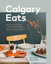 book cover image for Calgary Eats with a photo of food on a table with a chair.