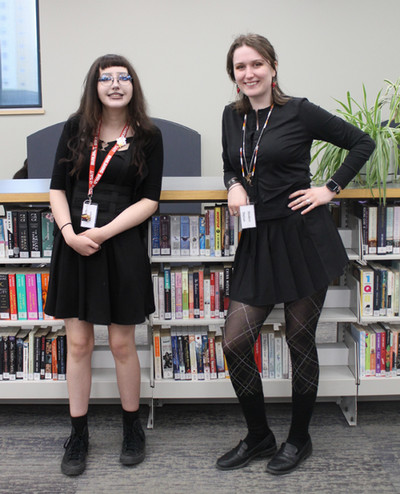 Phot of our two student shelvers, Liv and Blyth.