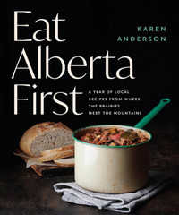 book cover image for eat alberta first with a photo of a pot of stew and some bread on a black background