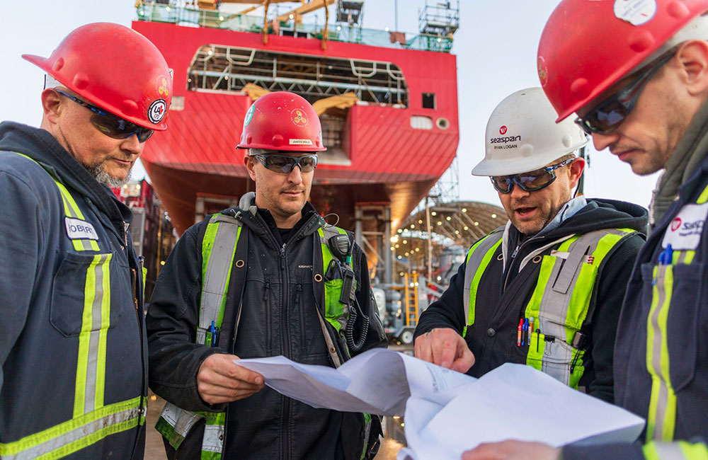 Shipbuilders working on a project
