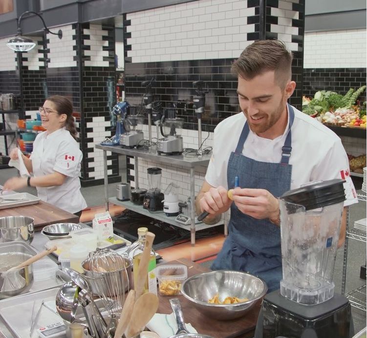Alex Edmonson cooking with other chef in kitchen