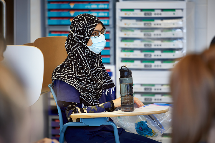 Optician student with mask on