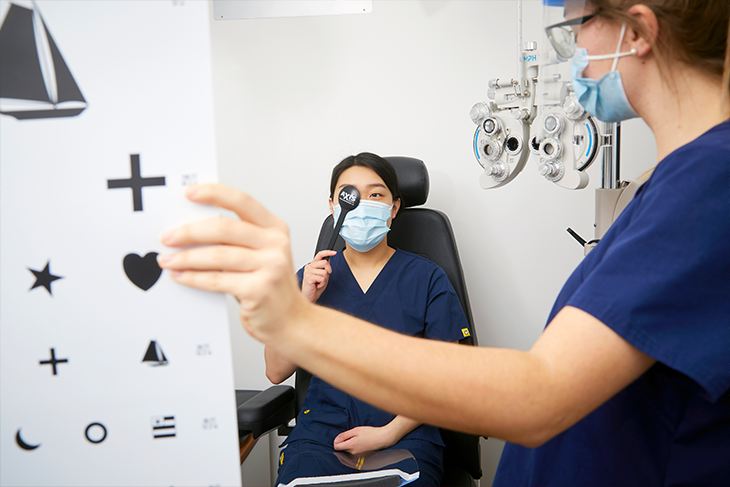 Optician students in lab