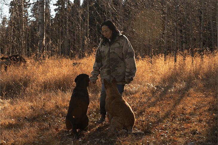 Marella Brooks outside with two dogs