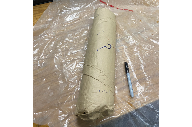 Photo of the package after the plastic was removed to reveal questions marks written all over. 