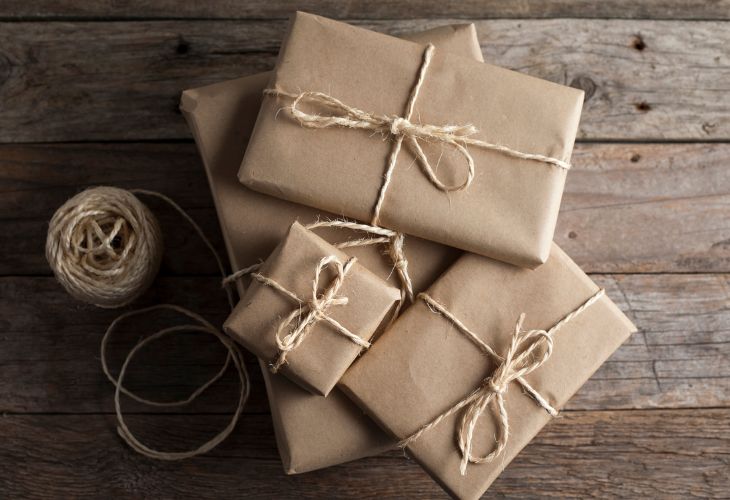 overtop view of present wrapped in brown paper