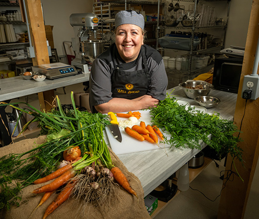 chef in kitchen preparing a meal
