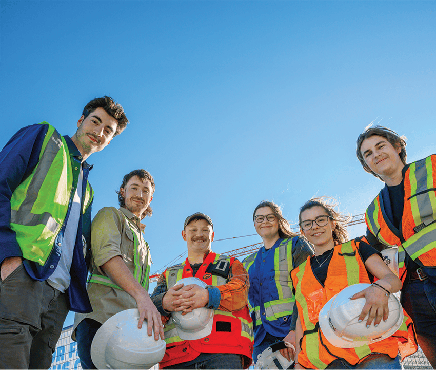 Group of students wearing construction safety gear
