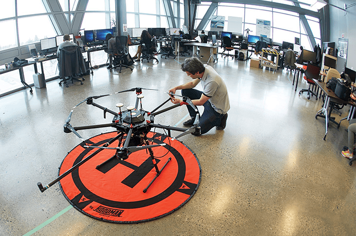 man doing maintenance on a drone