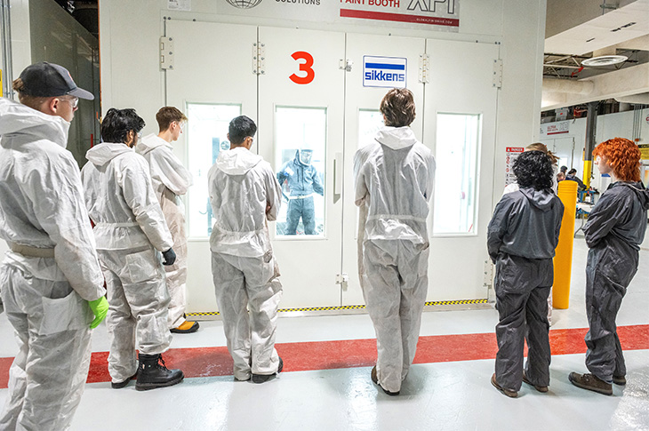 photo of back of students watching demonstrating