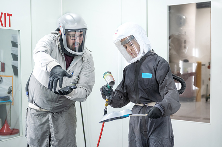 two people wearing protective gear