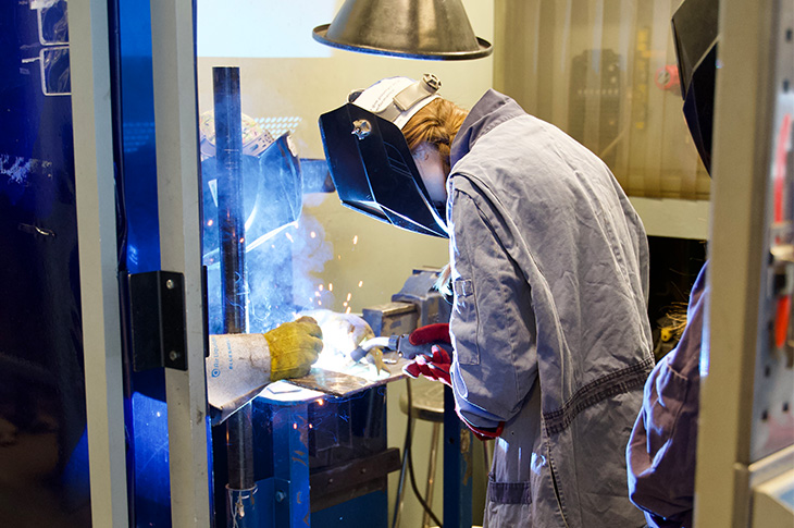 young girl welding