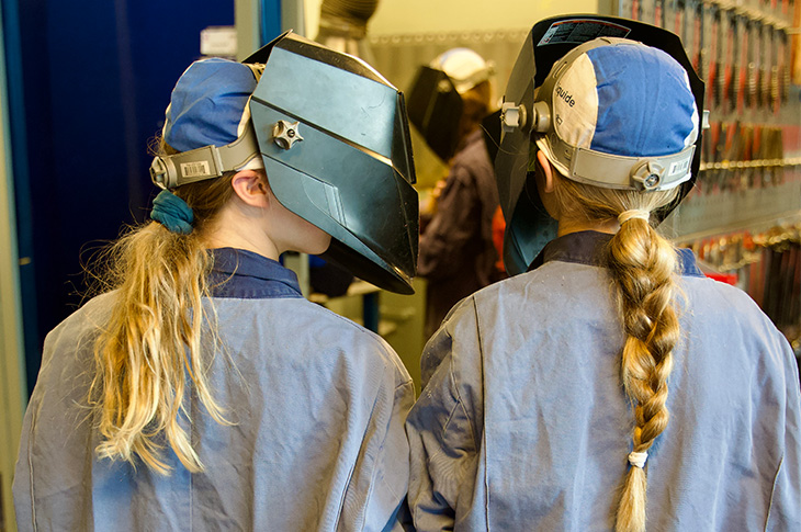 back shot of two student welders