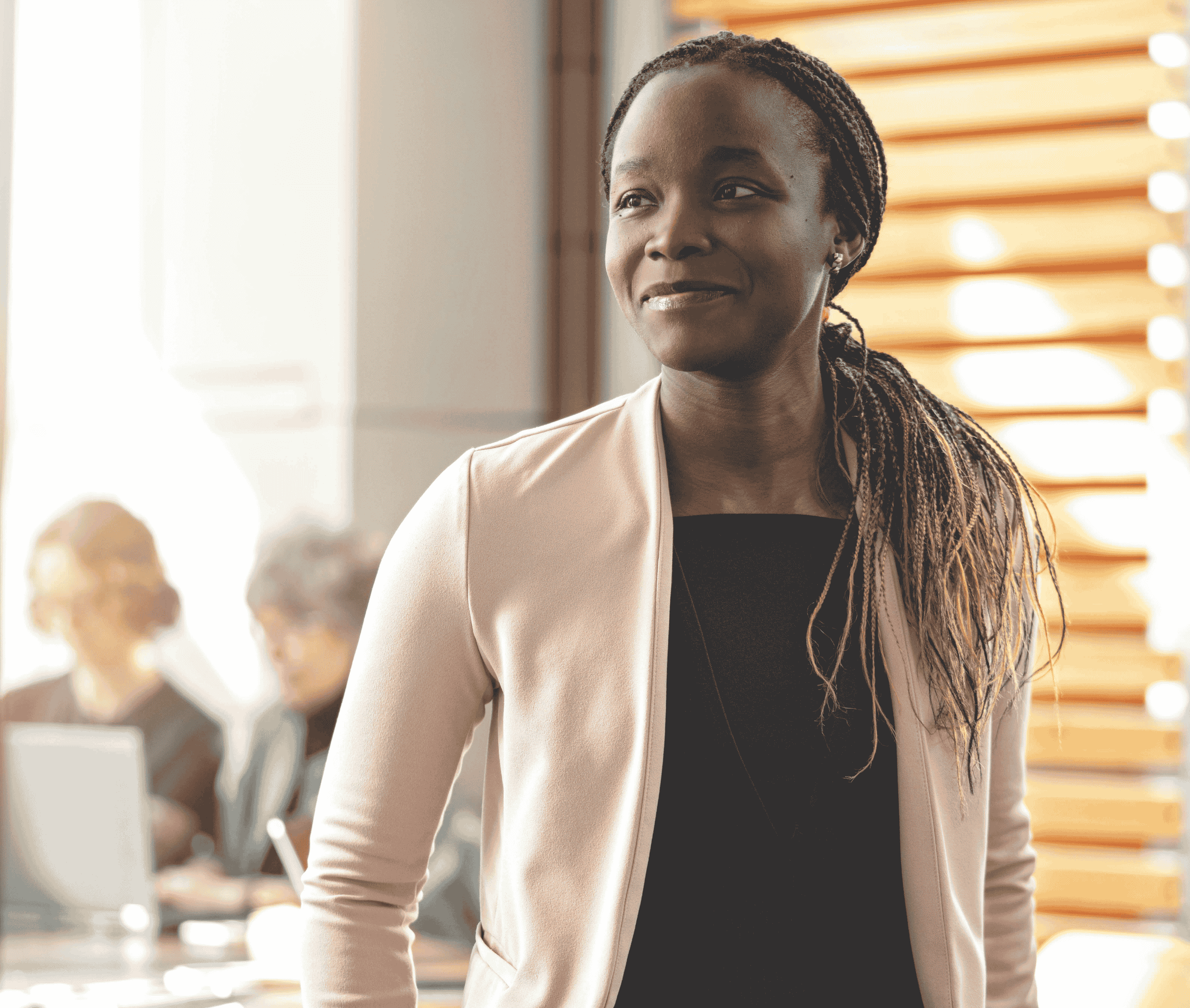 A woman in business casual clothing smiling