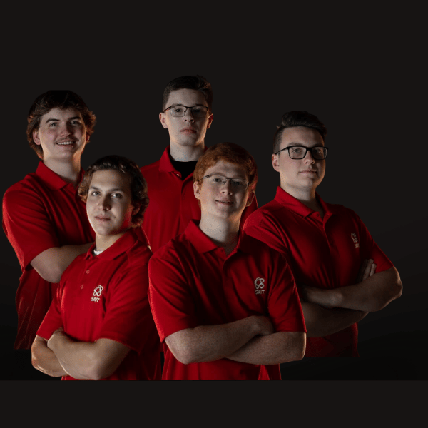 group of young men in red shirts