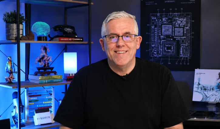 White male in black tshirt in podcast studio