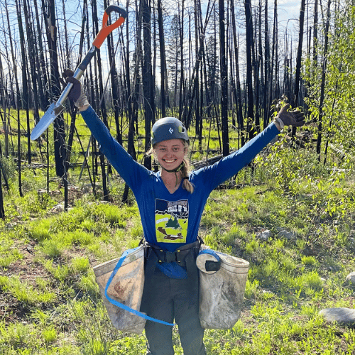 Young white woman with tree planting gear