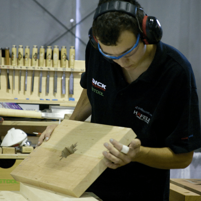 Young man working on wood project
