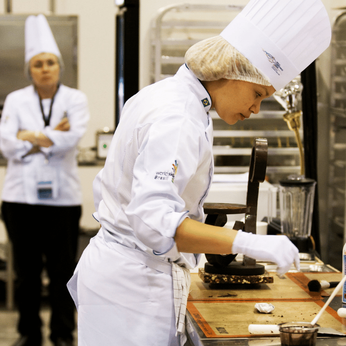 Chef working on plating at competition