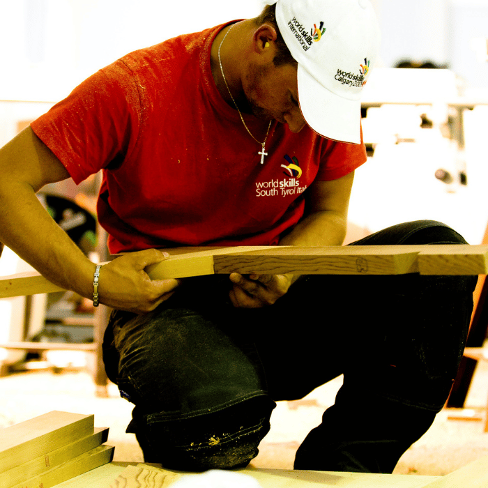Close up of man joining wood edges together